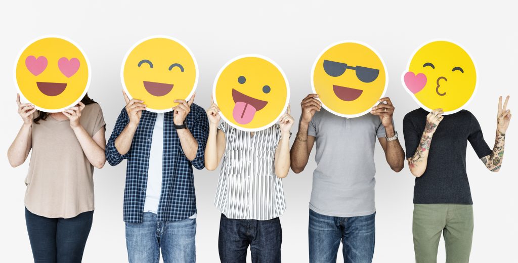 diverse people holding happy emoticons 1024x520 1