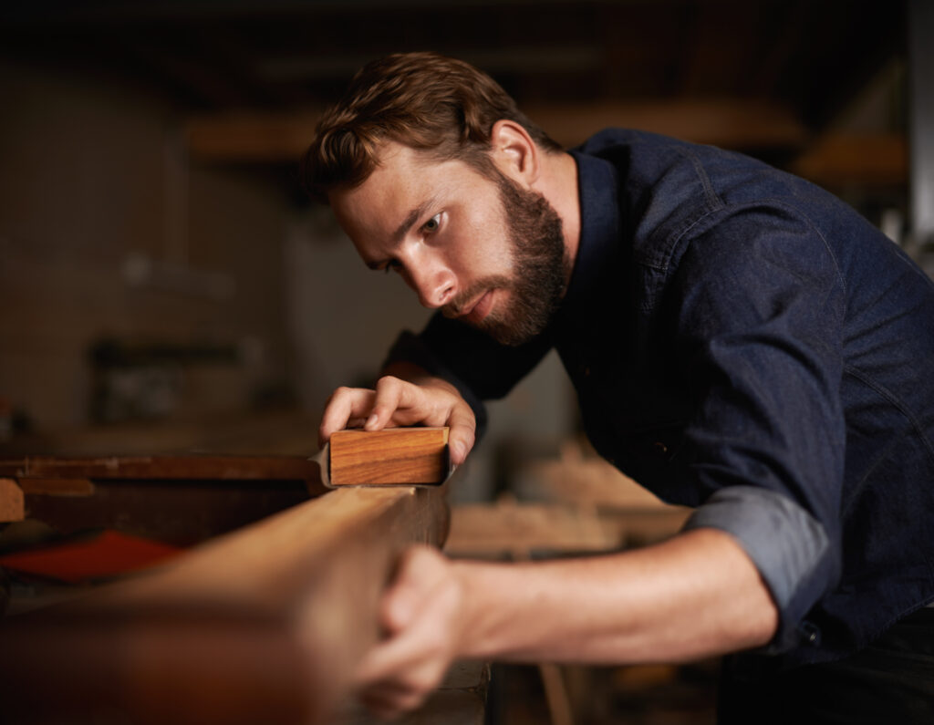 opportunity didnt knock he decided build door shot young artisan working intently his workshop 1024x795 1