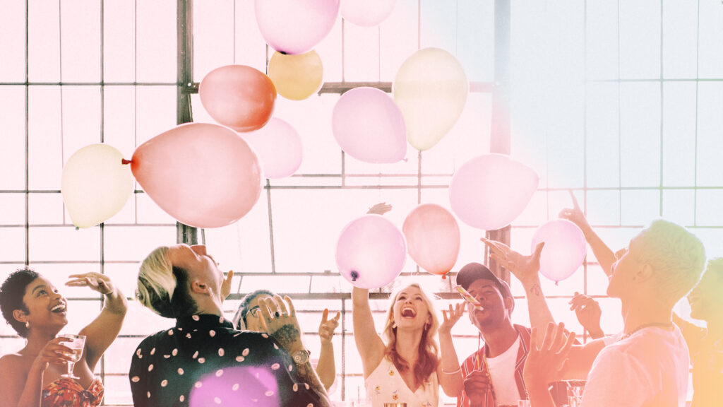 people playing with balloons party wallpaper 1024x576 1